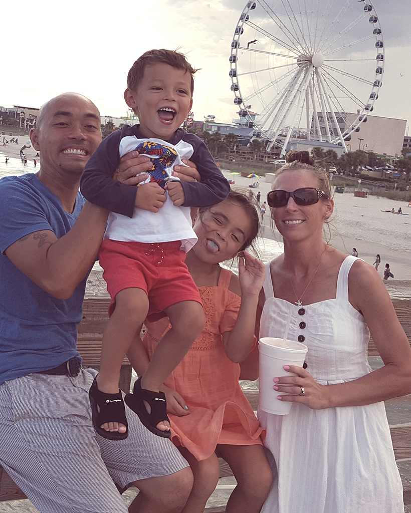 Family taking a trip to the ferris wheel